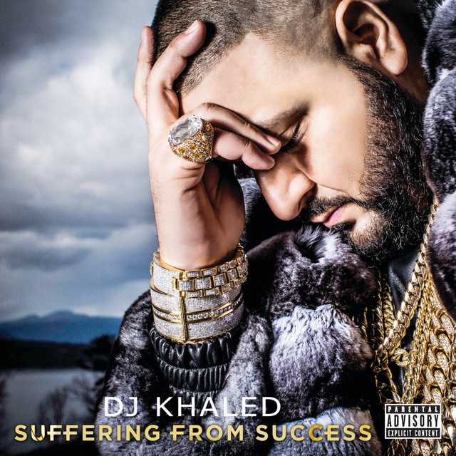 DJ Khaled's Album Cover Image of Suffering From Success, where he is holding hand over his head, wearing jewelry.